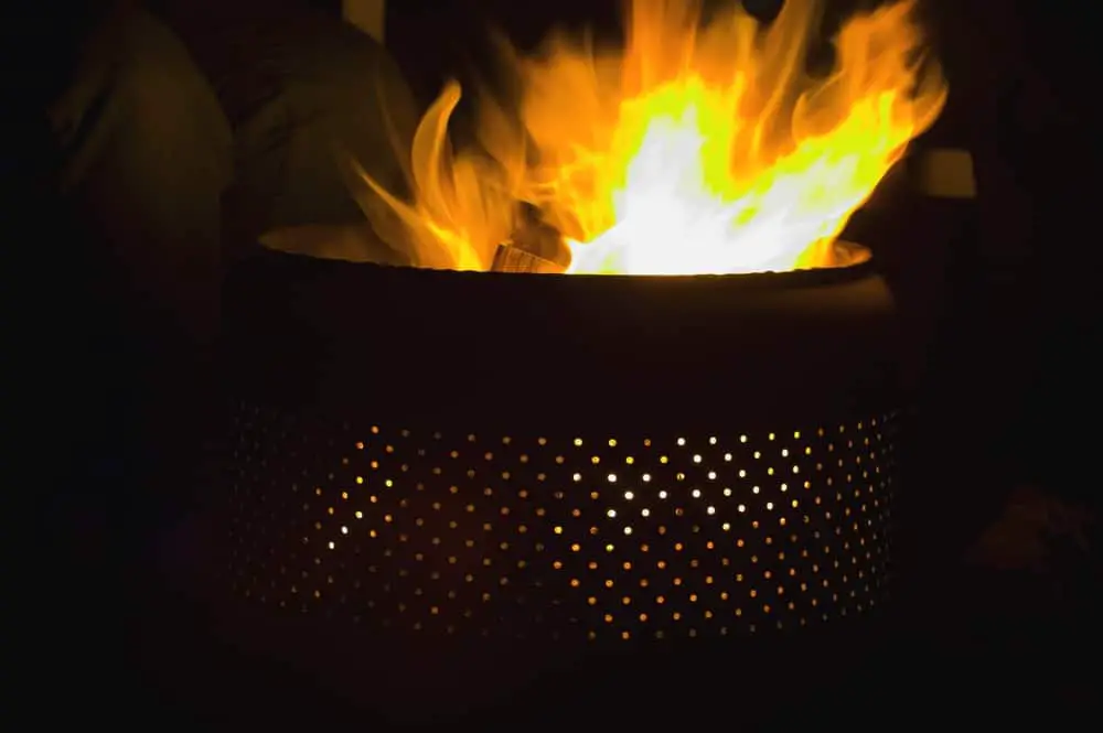Fire pit lit with holes